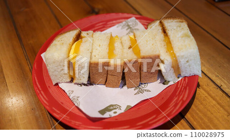 Srikaya toast or Coconut jam bread toast, popular dessert from Malaysians, Indonesians and Singaporeans, a toast bread with kaya jam is a sweet spread made from a base of coconut milk, eggs and sugar. 110028975