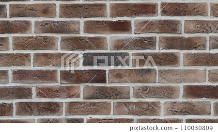 background texture of a fragment of a brick wall with brown blocks of different tones and white seams, beautiful graphic design resource of brickwork close-up in pleasant brownish shades background texture of a fragment of a brick wall with brown blocks of different tones and white seams, beautiful graphic design resource of brickwork close-up in pleasant brownish shades 110030809