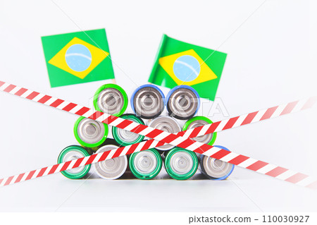 Battery. A lot of batteries on the background of the flag of the country. Battery. A lot of batteries on the background of the flag of the country. 110030927