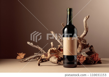 Bottle of red wine with a composition of old wood. Bottle of red wine with a composition of old wood. 110031153