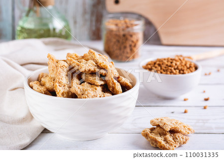 Dry dehydrated soy steaks and soy minced meat in bowls on the table Dry dehydrated soy steaks and soy minced meat in bowls on the table 110031335