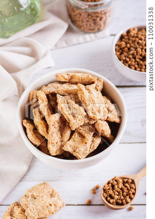 Alternative protein dry soy meat in a bowl on the table vertical view Alternative protein dry soy meat in a bowl on the table vertical view 110031338