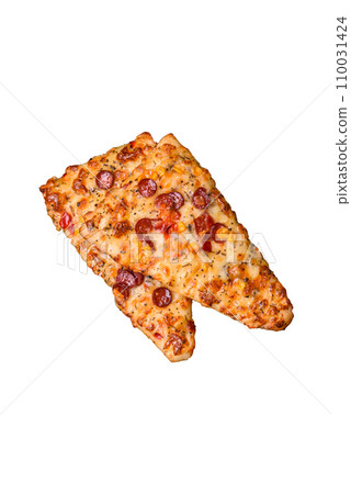 Delicious oven fresh flatbread pizza with cheese, tomatoes, sausage, salt and spices Delicious oven fresh flatbread pizza with cheese, tomatoes, sausage, salt and spices 110031424