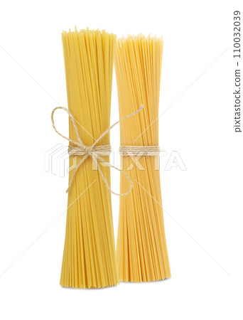 Bunch of spaghetti tied with a rope isolated on white background Bunch of spaghetti tied with a rope isolated on white background 110032039