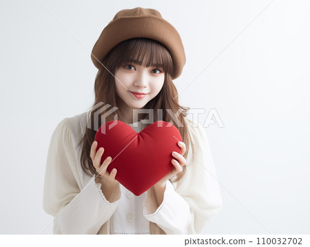 A smiling woman with a heart 110032702