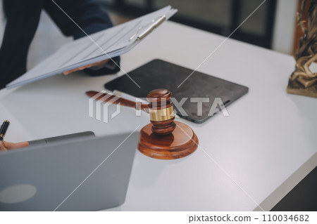Lawyer, legal advisor, businessman brainstorming information on agreement details Business contracts in legal processing books for accuracy in contract documents. joint financial investment. 110034682