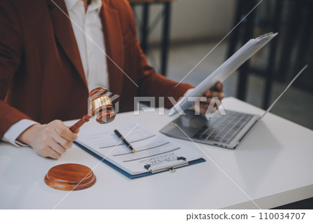 Lawyer, legal advisor, businessman brainstorming information on agreement details Business contracts in legal processing books for accuracy in contract documents. joint financial investment. 110034707