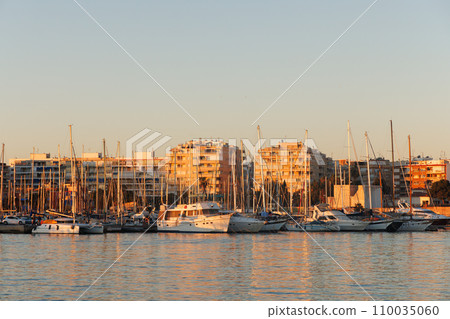 Sunset in the port of Torrevieja with motor and sailboats. Sunset in the port of Torrevieja with motor and sailboats. 110035060