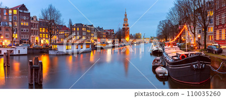 Amsterdam canal and tower Montelbaanstoren, Holland 110035260