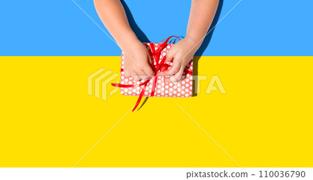 Little boy making a gift box from above Little boy making a gift box from above 110036790