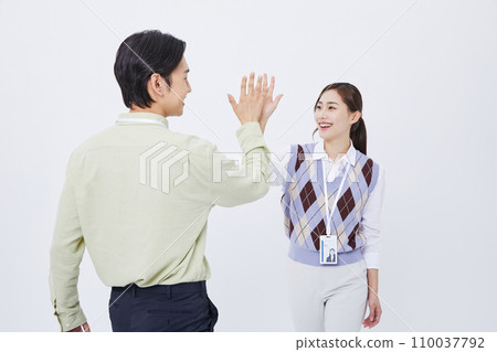collaborative business high-five male and female photo 110037792