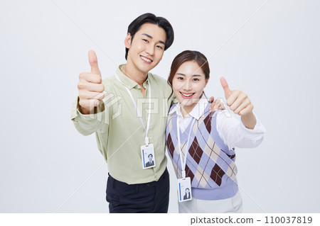 collaborative business thumbs up man and woman photo 110037819