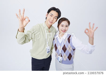 fighting business photo image of young people moving their hands okay sign 110037876