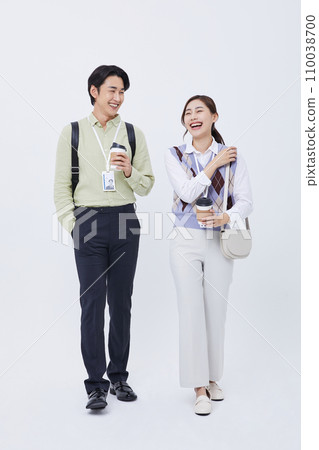 man and woman smiling and talking with a coffee cup man and woman smiling and talking with a coffee cup 110038700