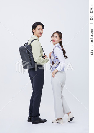 man and woman looking back with a smile 110038703