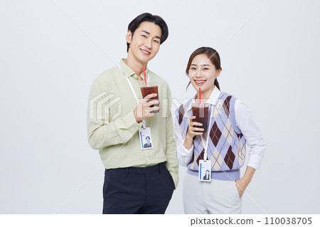 Work Stress_ man and woman standing smiling with coffee 110038705