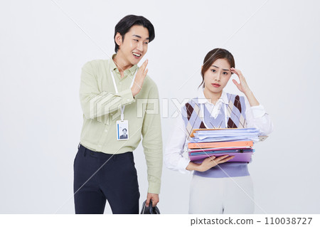 man greeting a woman with a lot of documents man greeting a woman with a lot of documents 110038727