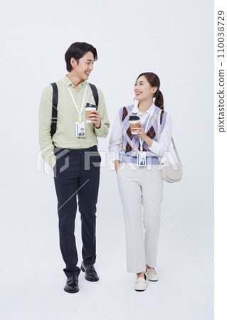 man and woman smiling and talking with a coffee cup man and woman smiling and talking with a coffee cup 110038729
