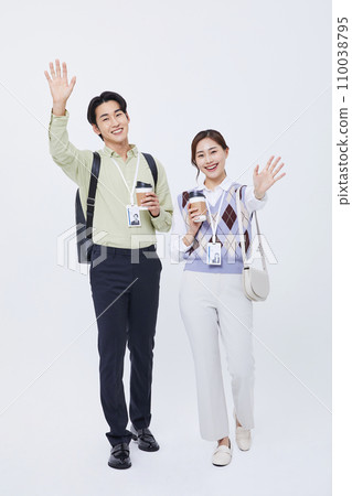 man and woman smiling and talking with a coffee cup man and woman smiling and talking with a coffee cup 110038795