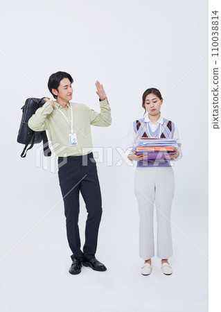 man leaving work greeting a woman holding a lot of documents man leaving work greeting a woman holding a lot of documents 110038814