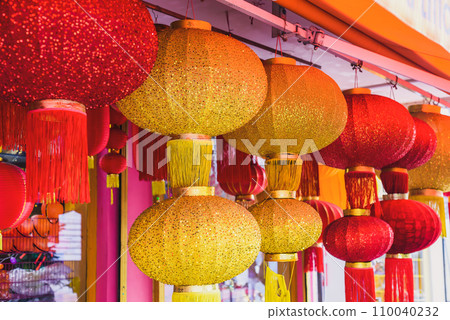 Many red and yellow lanterns hanging in Malaysia for Lunar New Year 110040232