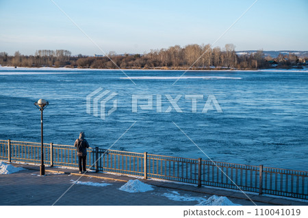 View of Irkutsk waterfront with Angara river in the morning. The Angara River is a river in Eastern Siberia and the only river flowing from lake Baikal. View of Irkutsk waterfront with Angara river in the morning. The Angara River is a river in Eastern Siberia and the only river flowing from lake Baikal. 110041019
