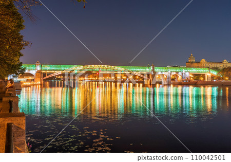 Pushkinskiy bridge with night illumination. Bridge to Gorky Park. Pushkinskiy bridge with night illumination. Bridge to Gorky Park. 110042501