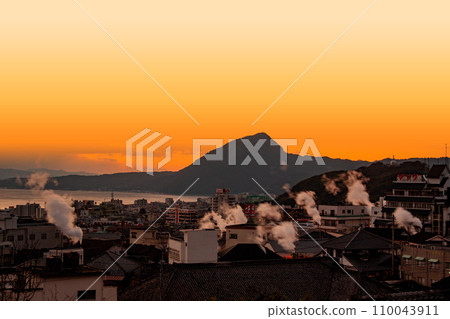 Beppu city morning glow and snowmobile 110043911