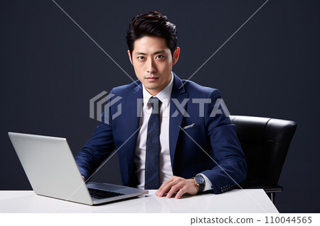 Businessman watching personal computer 110044565