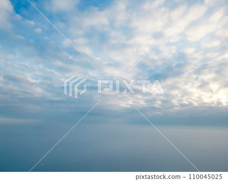 Serene Skyscape Above Mist Enshrouded Horizon Serene Skyscape Above Mist Enshrouded Horizon 110045025