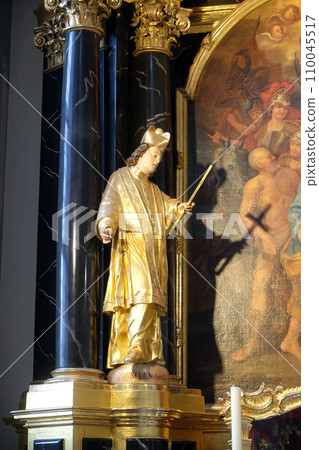 Statue of Saint, statue on the Saint Peter and Paul altar in the Neumunster Collegiate Church in Wurzburg, Germany 110045517