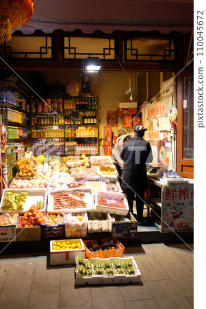 Store of fruit and vegetables on the Qianmen street, a famous old shopping street over hundreds years in Beijing, China Store of fruit and vegetables on the Qianmen street, a famous old shopping street over hundreds years in Beijing, China 110045672