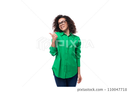 portrait of a brunette young caucasian lady with curly hair dressed in a green shirt portrait of a brunette young caucasian lady with curly hair dressed in a green shirt 110047718