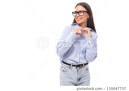 young pretty european brunette business woman with light makeup in a light blue blouse wears glasses young pretty european brunette business woman with light makeup in a light blue blouse wears glasses 110047737