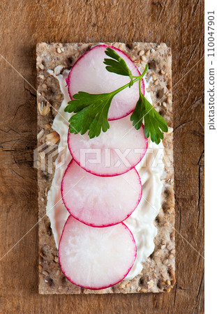 Radishes on crispbread Radishes on crispbread 110047901