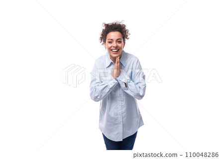 young pretty leader woman with curly black hair dressed with a light blue shirt on a white 110048286