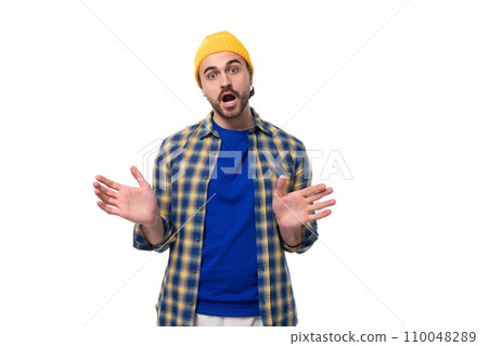 young attractive caucasian brunette handsome guy with a well-groomed beard and mustache in a plaid young attractive caucasian brunette handsome guy with a well-groomed beard and mustache in a plaid 110048289