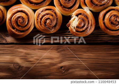 Cinnamon Rolls on Wooden Table 110048453