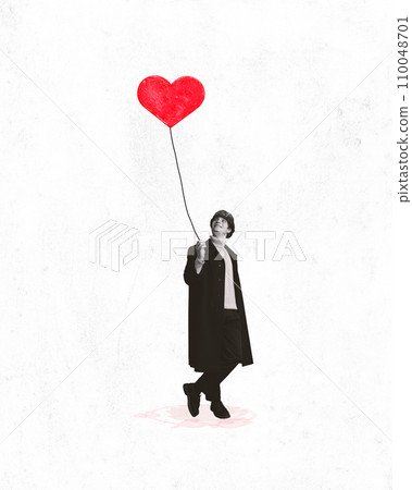 Poster. Contemporary art collage. Young charming man in black and white filter holds painted balloon that will give to his beloved. 110048701