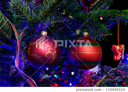 Festive Holiday Tree Decorated with Christmas Ornaments and Lights Festive Holiday Tree Decorated with Christmas Ornaments and Lights 110049334