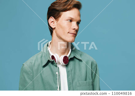 Stylish Urban Youth: Handsome Men Listening to Music with Headphones in the City Stylish Urban Youth: Handsome Men Listening to Music with Headphones in the City 110049816