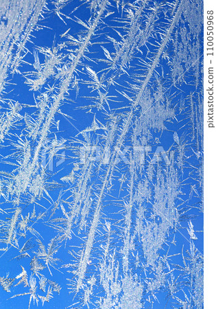 Ice on a window blue white vertical photo Ice on a window blue white vertical photo 110050968