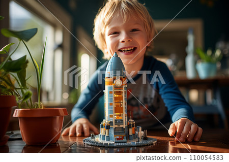 AI-generated content. A little Caucasian boy sits at the table in his cozy room and plays with a construction set. Happy smart kid assembling a realistic model of cosmodrome and spaceship. Play and 110054583