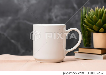 White mug mockup with office supplies on table and green plants in pot. Cup mock up showcase 110055237