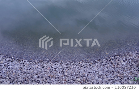 Crushed Stones Of The River Shoreline Close Up Crushed Stones Of The River Shoreline Close Up 110057230