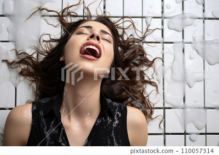 Young european woman having orgasm. Woman with open mouth and closed eyes enjoying sex lying on wet tiled floor in a shower, screaming in passion. Sexual experience, masturbation, cunnilingus. Young european woman having orgasm. Woman with open mouth and closed eyes enjoying sex lying on wet tiled floor in a shower, screaming in passion. Sexual experience, masturbation, cunnilingus. 110057314