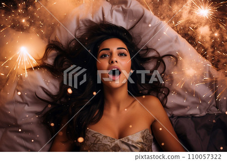 Young multiracial woman having orgasm. Beautiful woman with open mouth and closed eyes enjoying sex lying among fireworks. Sparklers as a symbol of orgasm. Sexual experience, masturbation, cunnilingus Young multiracial woman having orgasm. Beautiful woman with open mouth and closed eyes enjoying sex lying among fireworks. Sparklers as a symbol of orgasm. Sexual experience, masturbation, cunnilingus 110057322