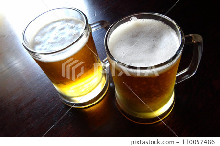 Two glasses of lager beer on the table top view Two glasses of lager beer on the table top view 110057486