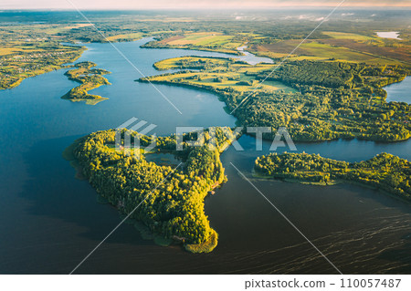 Lyepyel, Lepel Lake, Beloozerny District, Vitebsk Region. Aerial View Of Island Pension Lode In Autumn Morning. Morning Fog Above Lepel Lake. Top View Of European Nature From High Attitude In Autumn Lyepyel, Lepel Lake, Beloozerny District, Vitebsk Region. Aerial View Of Island Pension Lode In Autumn Morning. Morning Fog Above Lepel Lake. Top View Of European Nature From High Attitude In Autumn 110057487