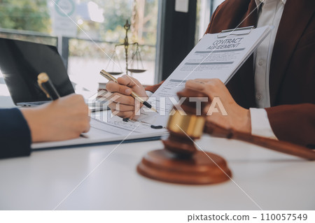 Lawyer, legal advisor, businessman brainstorming information on agreement details Business contracts in legal processing books for accuracy in contract documents. joint financial investment. 110057549